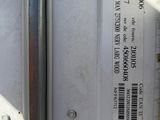 a close up of a metal door with a sticker on it