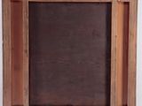 an old wooden picture frame with a black and white picture on it