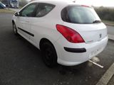 a white car that is parked in a parking lot