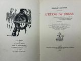 an open book with a drawing of a man on a ladder