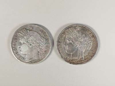 deux pièces d'argent, dont l'une représente la tête d'une femme et l'autre la tête d'un