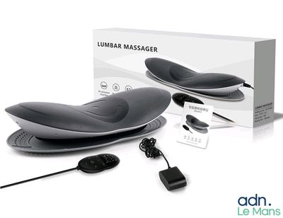 une photo d'un appareil de massage dans une boîte, accompagné d'une télécommande