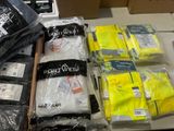 a lot of yellow and black clothing on a table