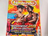 magazine cover of two men fighting each other on a white surface