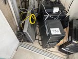 a lot of computer equipment that are on the floor