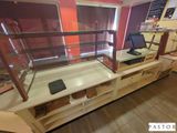 a glass display case with a laptop on top of it