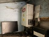 an old kitchen with a microwave, oven and a microwave oven