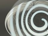 a glass vase with a spiral design on it