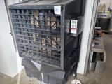 a black air conditioner sitting on top of a cart in a garage
