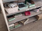 many boxes of nuts and screws on a shelf