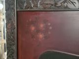 a close up of a red door with flowers on it