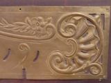 a metal plaque with a decorative design on it
