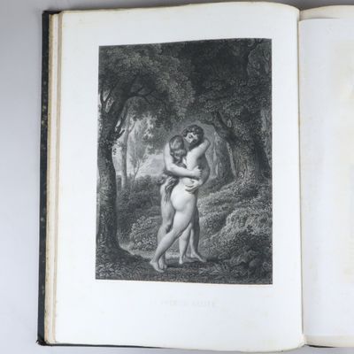 un livre ouvert sur lequel figure le dessin d'une femme nue enlacée par un homme