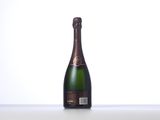 a close up of a bottle of champagne on a table