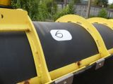 a large black and yellow pipe with a number 6 on it