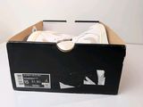 a box with a pair of shoes in it on a table
