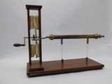 a clock that is on a stand with a knife