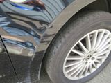 a close up of a car ' s tire with a sticker on it
