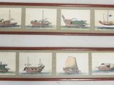 three framed pictures of boats on a wall in a room