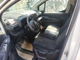the interior of a car with the door open and the driver ' s seat down