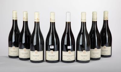 six bottles of red wine lined up in a row