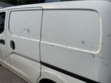 a white van that is parked in a parking lot