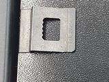 a close up of a piece of metal with a hole in it