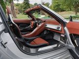 the interior of a sports car with the door open