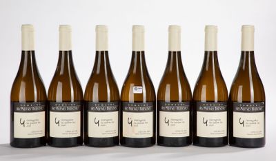 six bottles of wine are lined up in a row