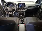 the interior of a car with a steering wheel, dashboard, and dashboard controls