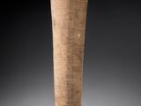 an image of a tall wooden vase with a wooden handle