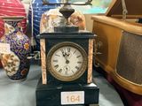 a clock that is sitting on a table in a room