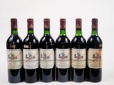 six bouteilles de vin sont alignées sur une surface blanche
