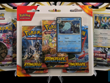 trois paquets de cartes à collectionner Pokémon dans un présentoir
