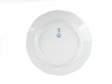 a white plate with a blue dot on it and a white plate with a blue dot on it
