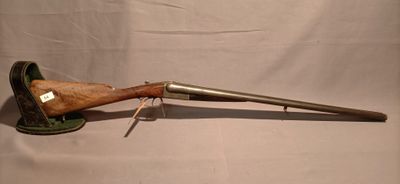 an old gun with a wooden handle on a white background