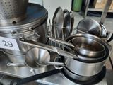 many pots and pans that are on the stove