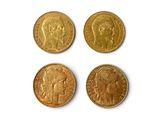 quatre pièces d'or sur lesquelles figurent une tête de femme et une tête d'homme