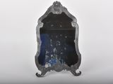 a mirror that is sitting on top of a table