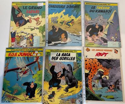 six comics of different sizes and colors are on a table