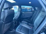 the back seats of a car are empty in a parking lot