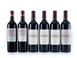 six bottles of wine are lined up on a white surface