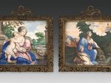 two framed paintings of a woman holding a child and a man holding a baby