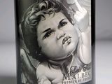 a bottle of wine with a drawing of a baby on it