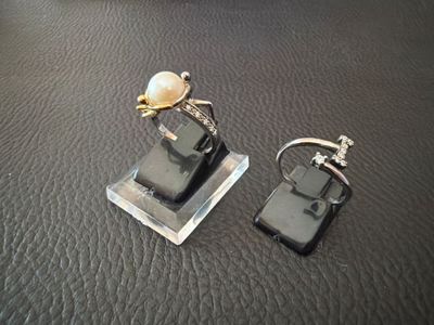 two cell phones that are sitting on a table