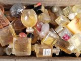 a wooden box full of perfume bottles and bottles of perfume