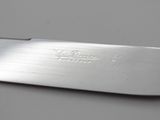a knife that is laying on a table