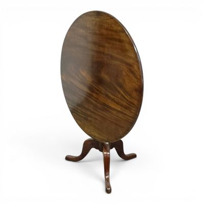 a round table with a wooden base and a wooden top