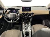 the interior of a car with a steering wheel, dashboard, and dashboard controls