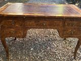 a wooden desk with drawers and drawers on top of it